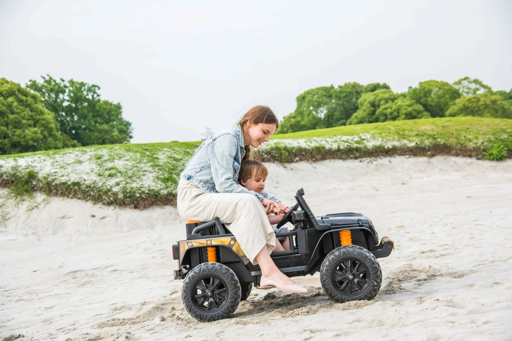 Kids Cars Jeep Kids sitting with mom on Ride on Cars Side View on Beach