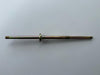 Gold-colored metal rod