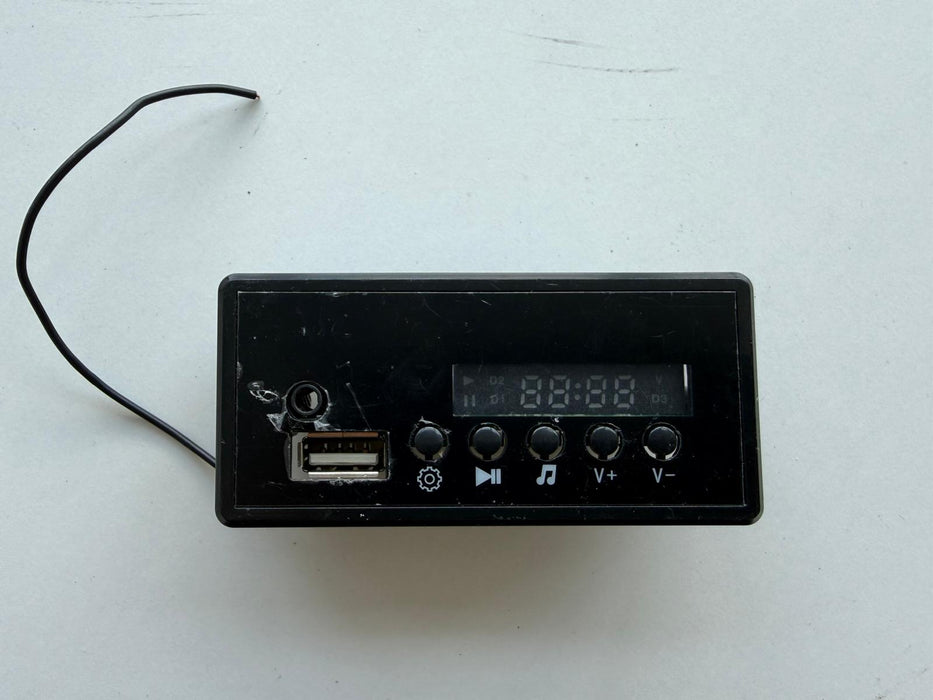 Black electronic device with USB port and digital display 