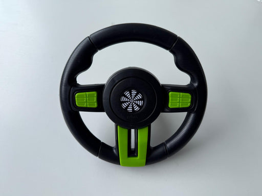 Black and green steering wheel toy 
