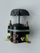 Mechanical component with black housing, copper terminals, and a central shaft 