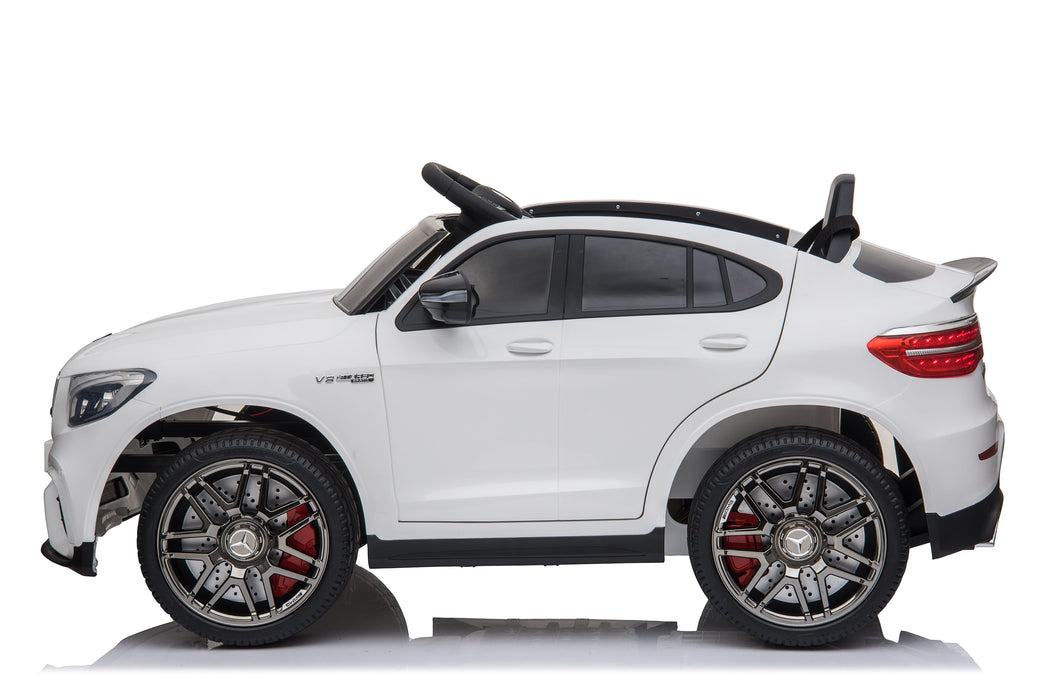 White toy car with black roof and red accents