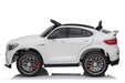 White toy car with black roof and red accents