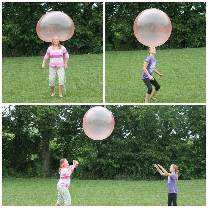 Mother and Daughter Playing with air wubble bubble ball in garden
